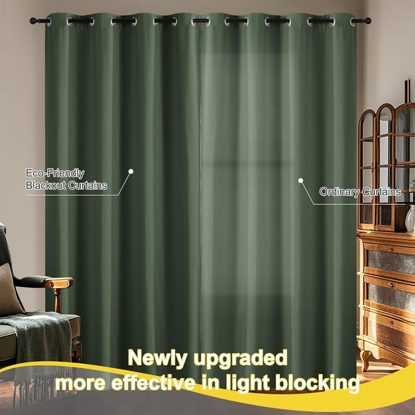 Deep green blackout curtain with black grommet top hanging, effectively blocking light in a room.