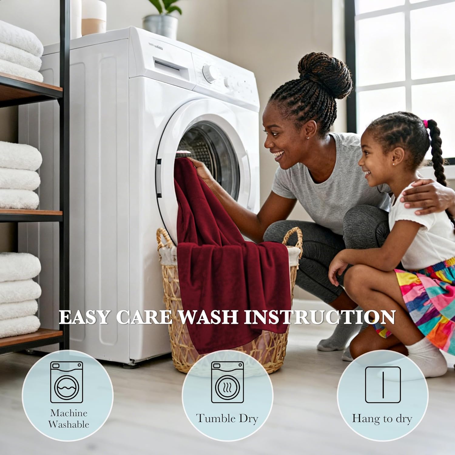 A woman and child happily putting a soft, deep red blanket into a washing machine, demonstrating its easy care.