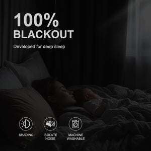 Mother and baby sleeping in a dark bedroom, illustrating the effectiveness of blackout curtains.