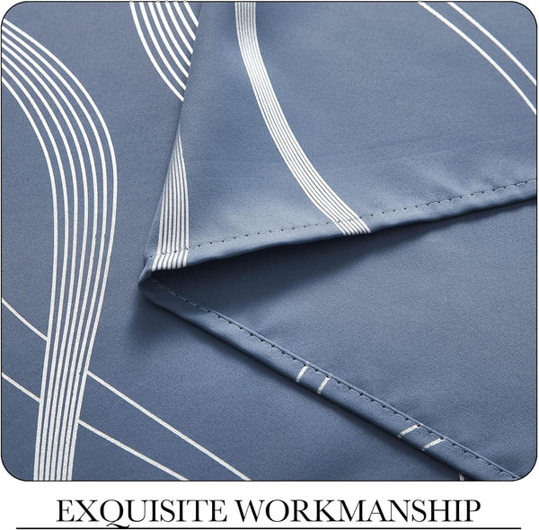 Detailed view of dusty blue curtain fabric featuring white abstract geometric lines and precise stitching.