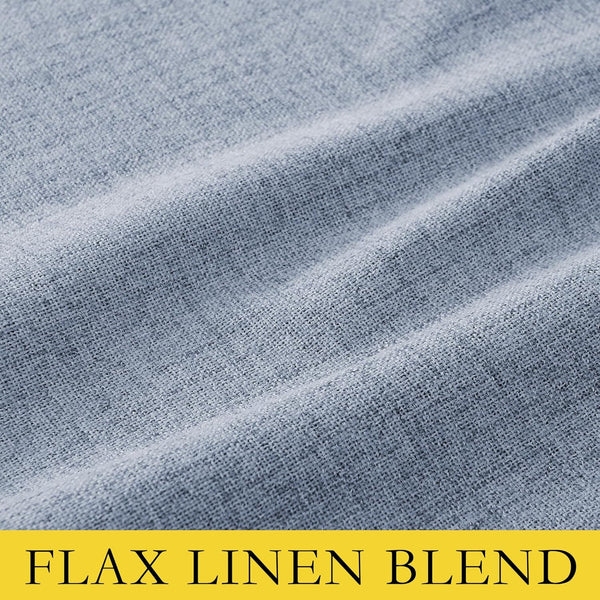 Close-up of dusty blue flax linen blend fabric with a visible woven texture and soft folds.