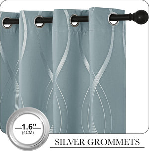 Dusty blue curtains with shiny silver wavy geometric pattern and 1.6-inch silver grommets, hanging on a dark rod.