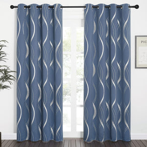 Modern dusty blue grommet curtains with bold silver metallic wavy lines covering a window.