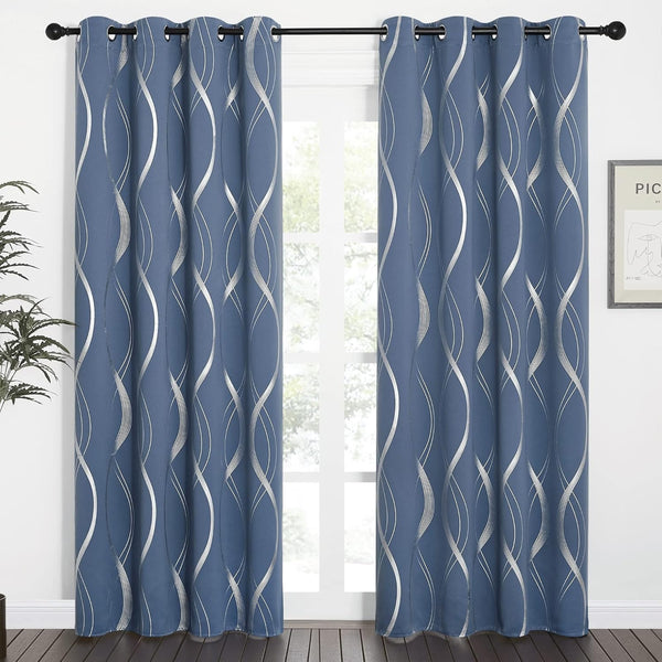 Modern dusty blue grommet curtains with bold silver metallic wavy lines covering a window.