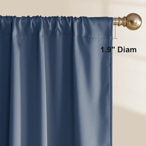 Close-up of a dusty blue rod pocket curtain hanging on a gold rod, showing a 1.9-inch diameter.