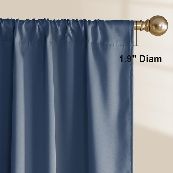 Close-up of a dusty blue rod pocket curtain hanging on a gold rod, showing a 1.9-inch diameter.