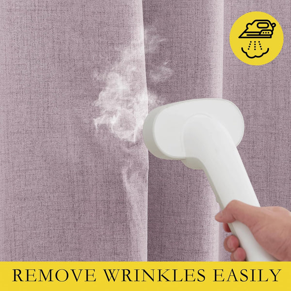 Dusty pink linen-textured curtains being steamed, highlighting easy wrinkle removal.