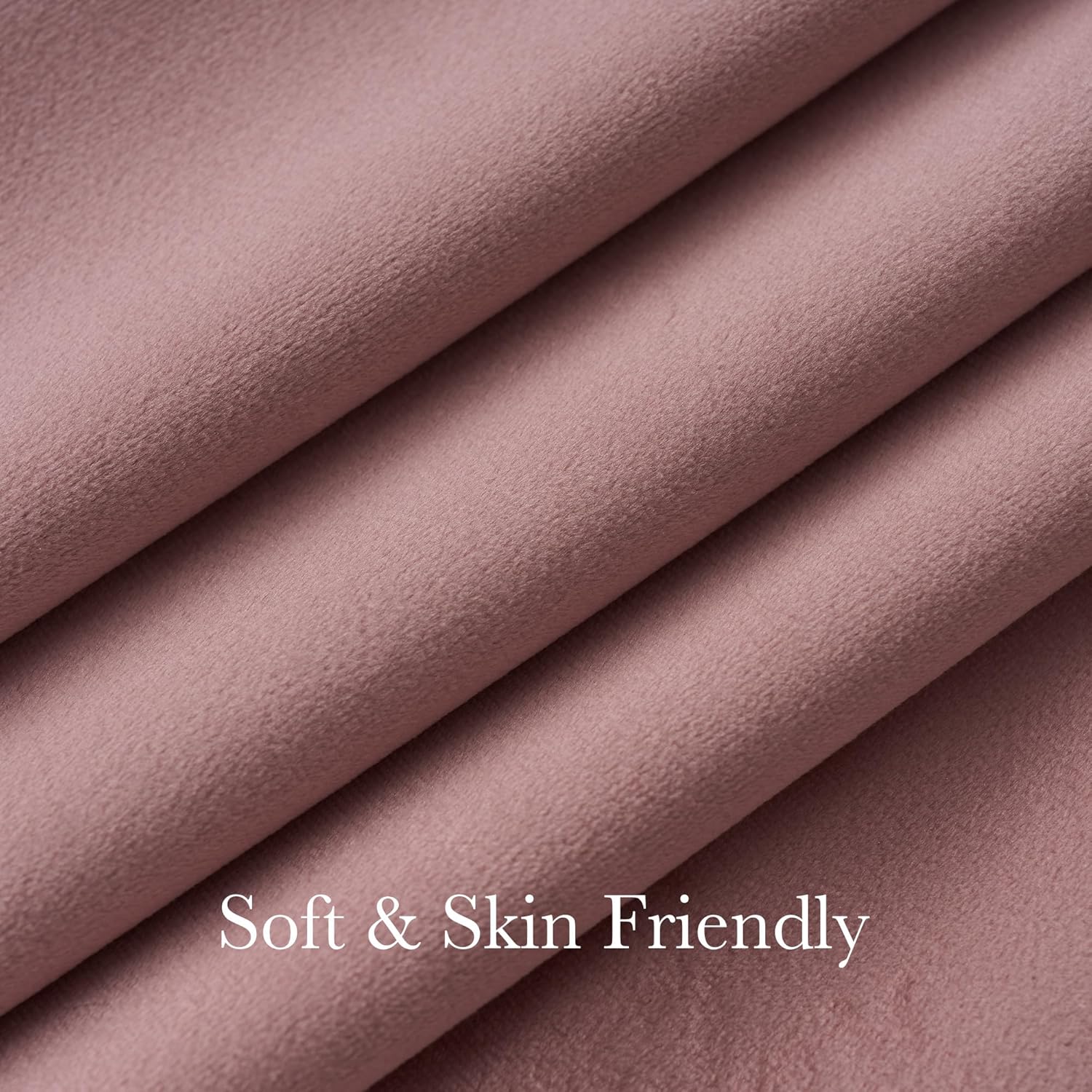 Close-up of dusty rose soft microfleece fabric with gentle folds, emphasizing skin-friendly texture.
