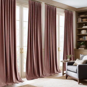 Dusty rose velvet pleated drapes hang on a gold rod over large French doors in a sophisticated living room.