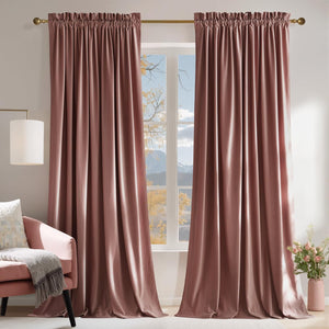 Pair of dusty rose velvet curtains with gathered rod pocket tops, elegantly hanging on a brass rod in a bright living room.
