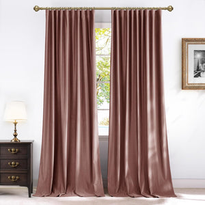 Elegant dusty rose velvet curtains with a soft sheen, hung on a decorative brass rod, reaching the floor.