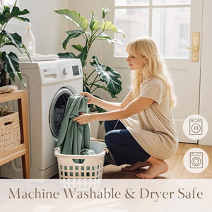 Woman puts soft green fabric into washer. Icons highlight machine washable and dryer safe.