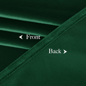 Deep emerald green fabric sample showing the soft velvet front and tightly woven back.