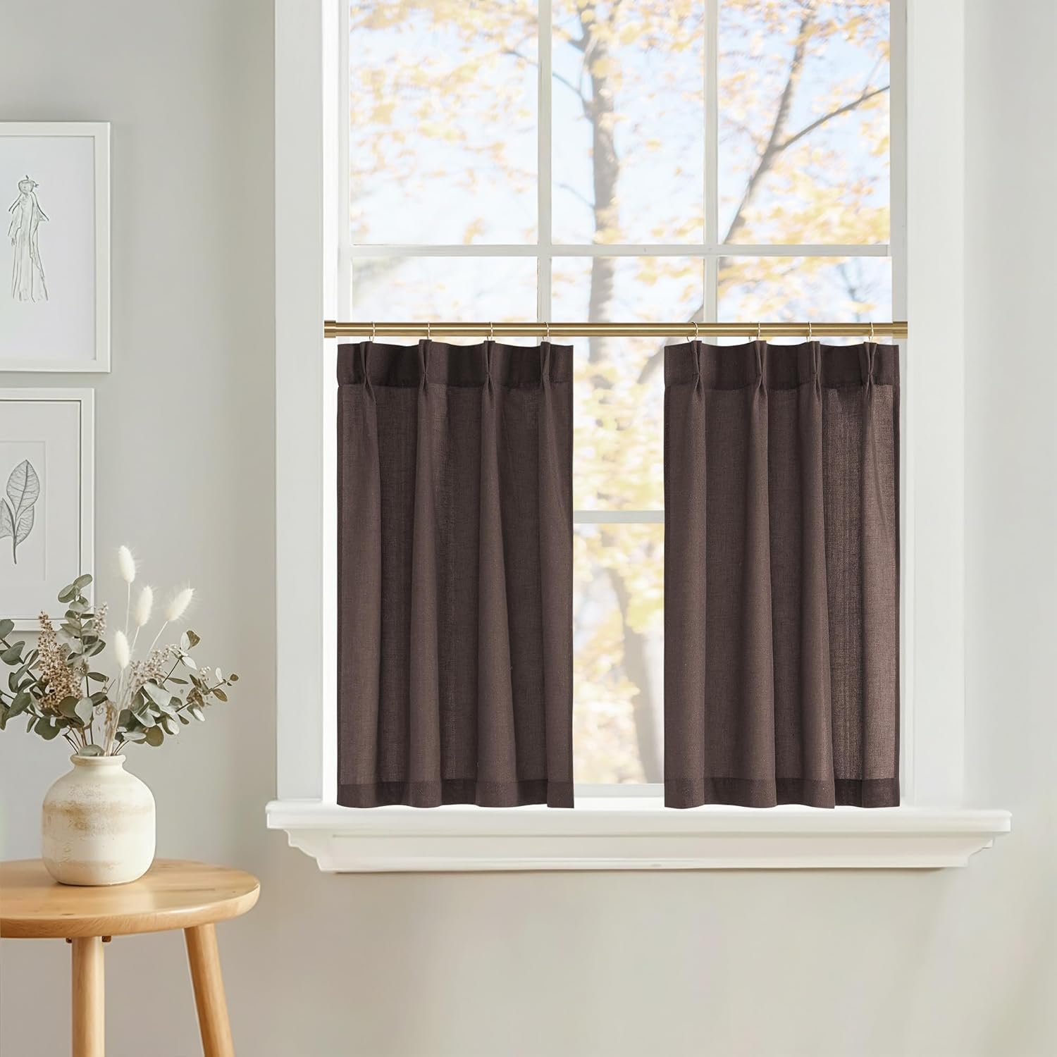 Espresso brown semi-sheer cafe tier curtains with textured weave hanging on a gold rod.