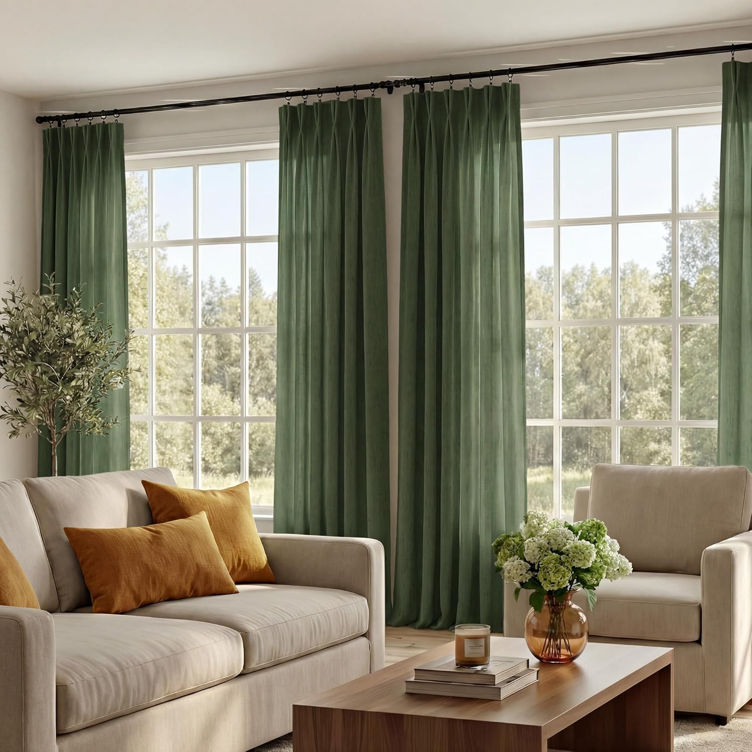 Forest green linen-blend curtains with tailored pleats hang from a black rod in a bright living room.