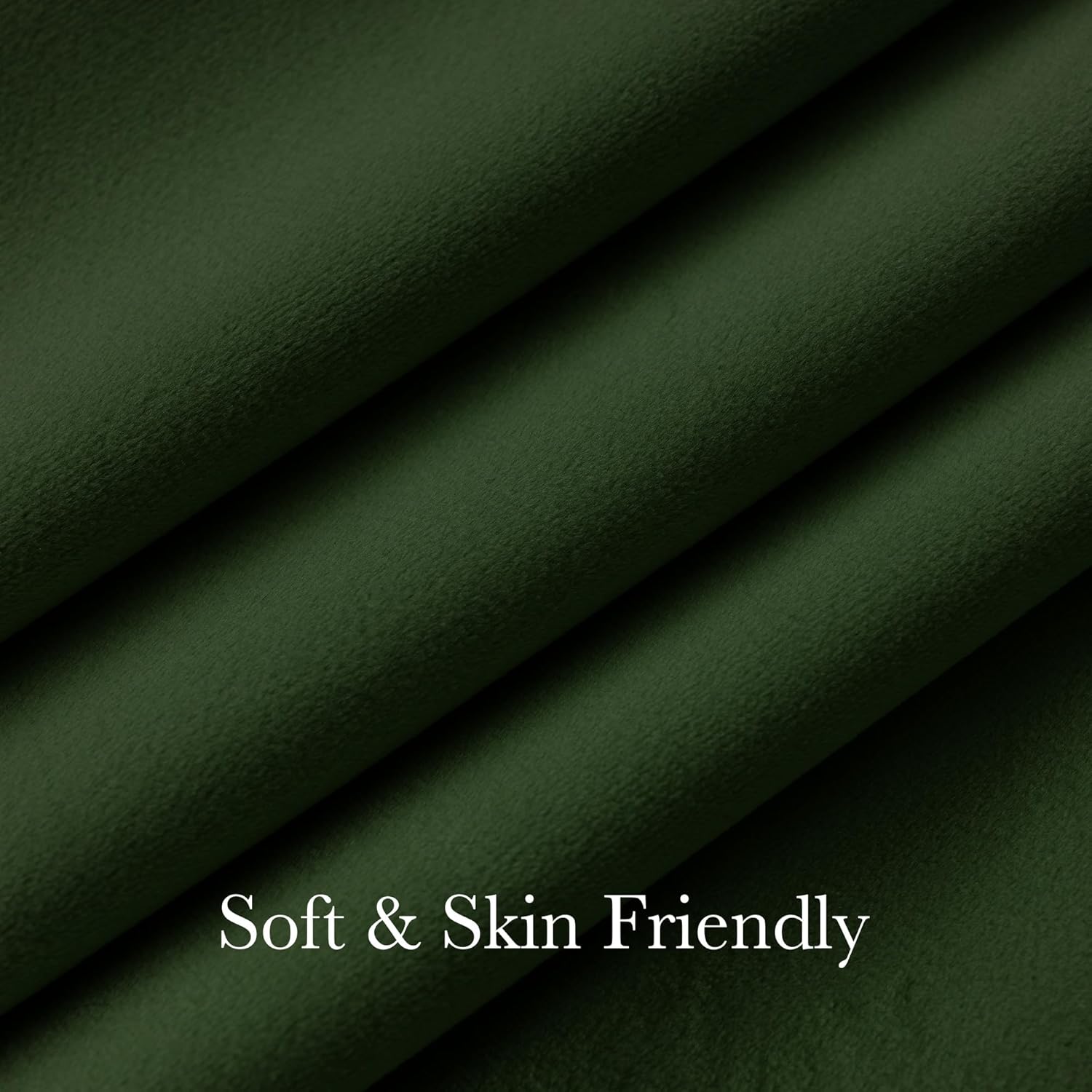Close-up of dark forest green fabric, highlighting its soft, plush, and skin-friendly texture with gentle folds.