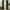 Luxurious forest green velvet curtains with tailored pinch pleats on black rod, framing sunlit window.