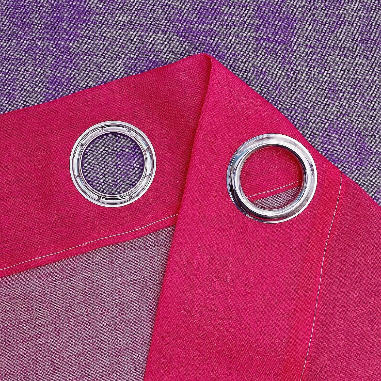 Close-up of a fuchsia sheer curtain panel with silver metal grommets
