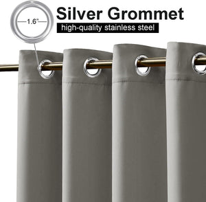 Gray blackout curtains featuring 1.6-inch silver stainless steel grommets on a gold rod.