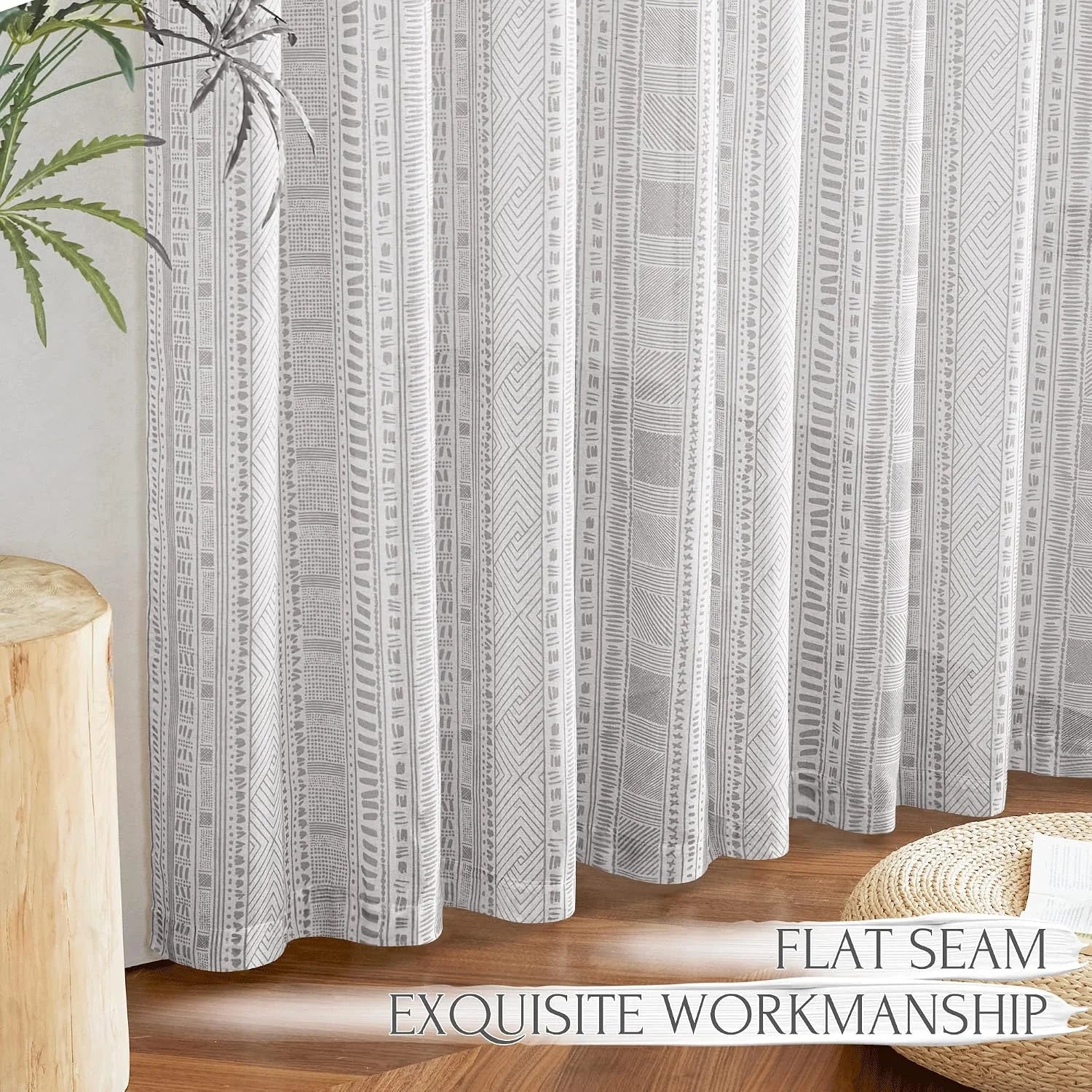 Gray boho patterned curtain with flat seam detail in a bright natural room