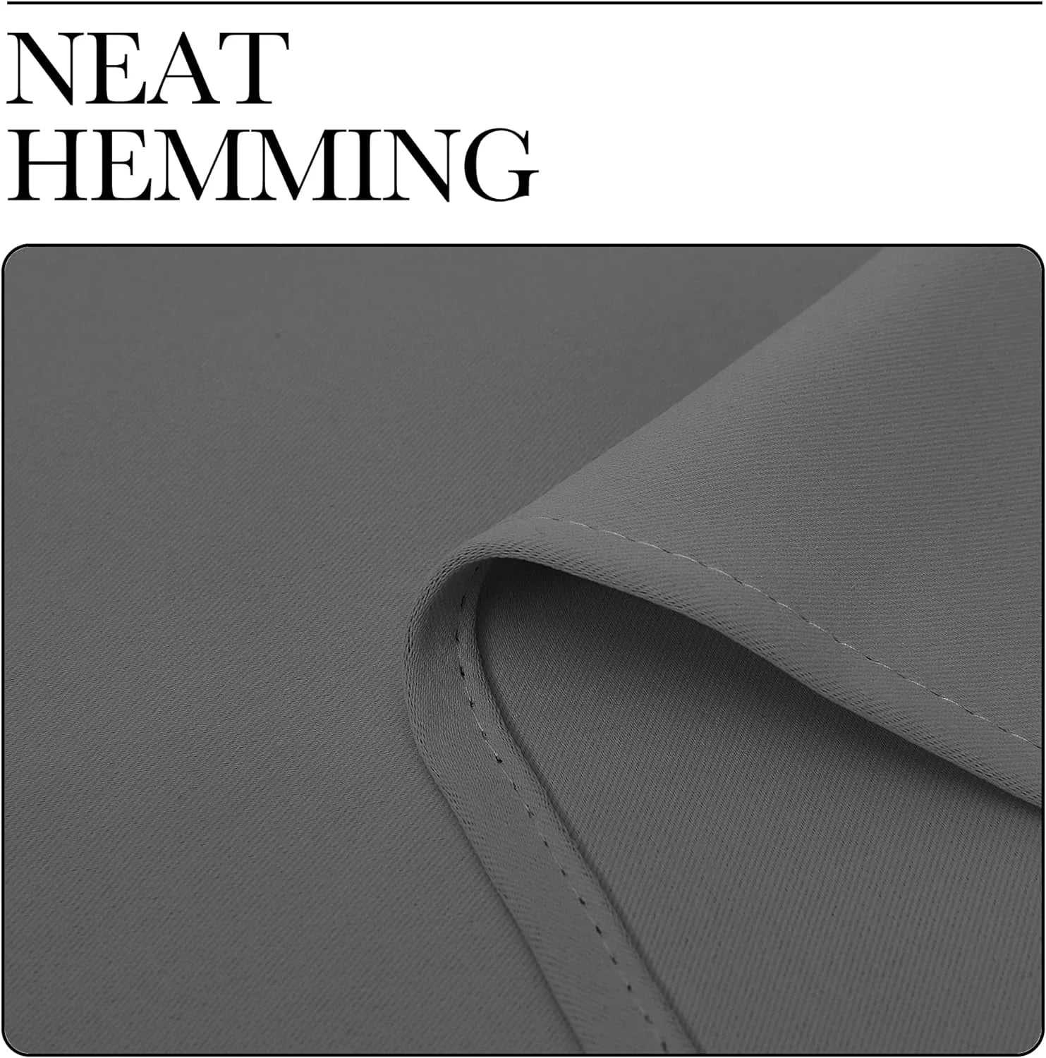 Close-up of gray curtain fabric with neat hemming and visible stitched edge
