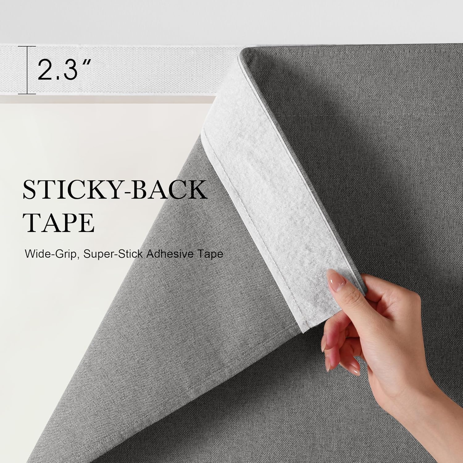 A hand peels back charcoal gray textured fabric, revealing a 2.3-inch wide white sticky-back adhesive tape.