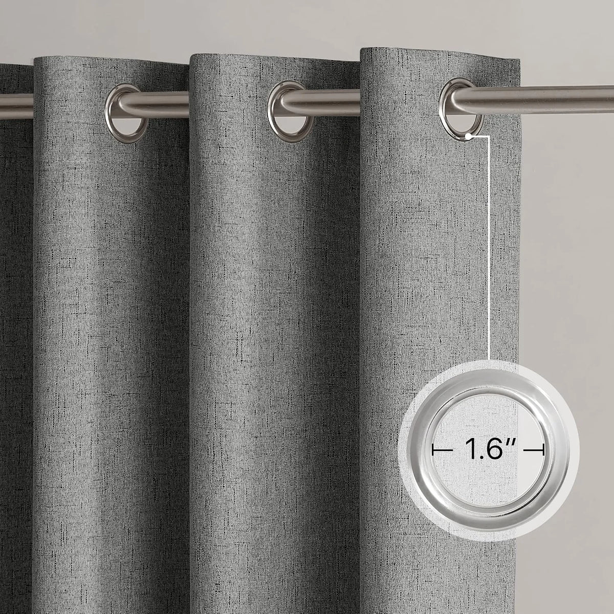 Gray linen-look curtain panel with silver metal grommets on a brushed rod