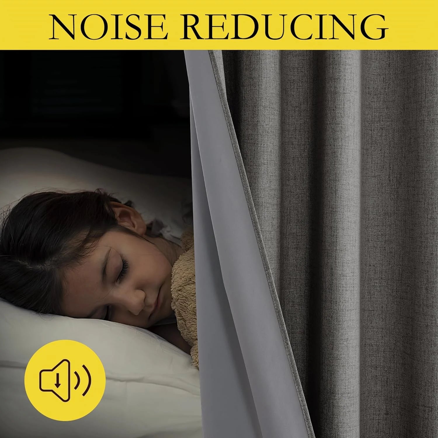 Gray noise-reducing blackout curtain beside a sleeping child in a dark bedroom