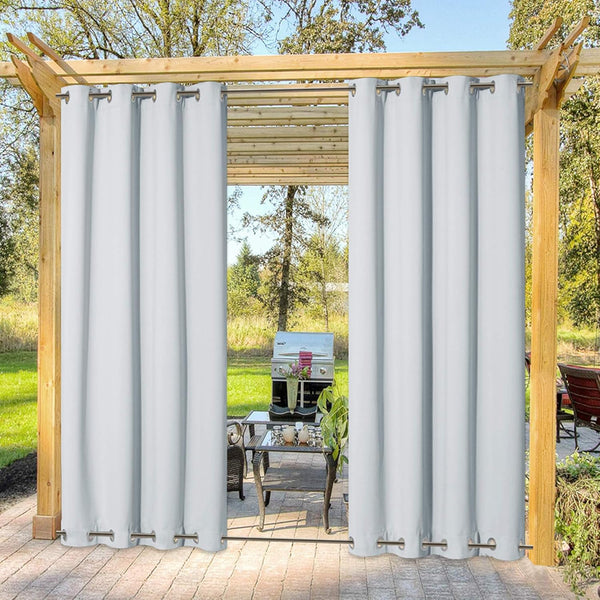 Light gray outdoor curtains with top and bottom grommets on a wooden pergola.