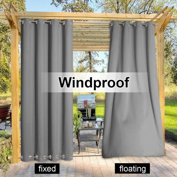 Two gray windproof outdoor curtains with grommet tops on a wooden pergola, showing fixed and floating panels.