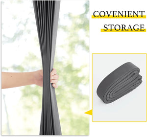 Hand holding gray pleated cellular window shade, demonstrating flexibility and roll-up storage.