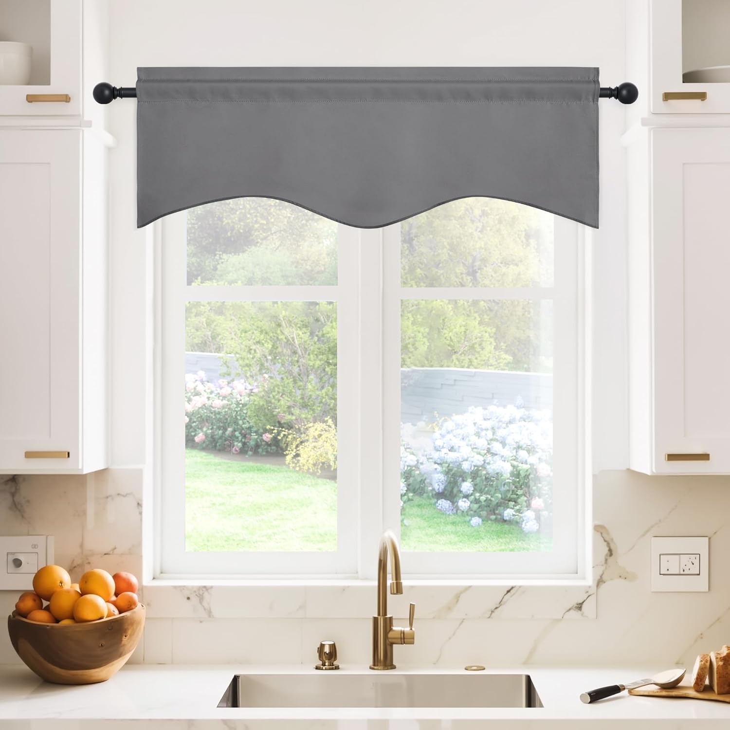 Gray window valance with a scalloped bottom edge and rod pocket, hung above a modern kitchen sink.