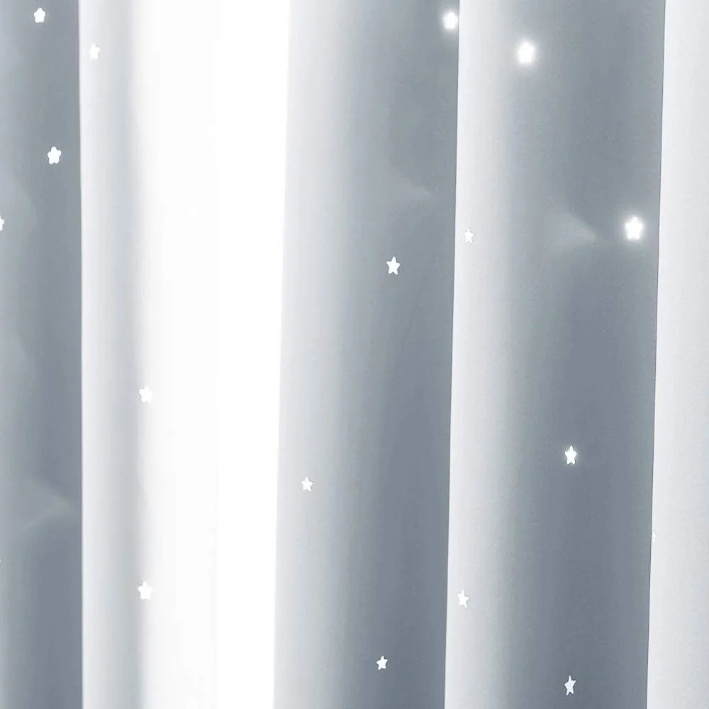 Gray sheer curtain panel with small white star print and soft vertical folds