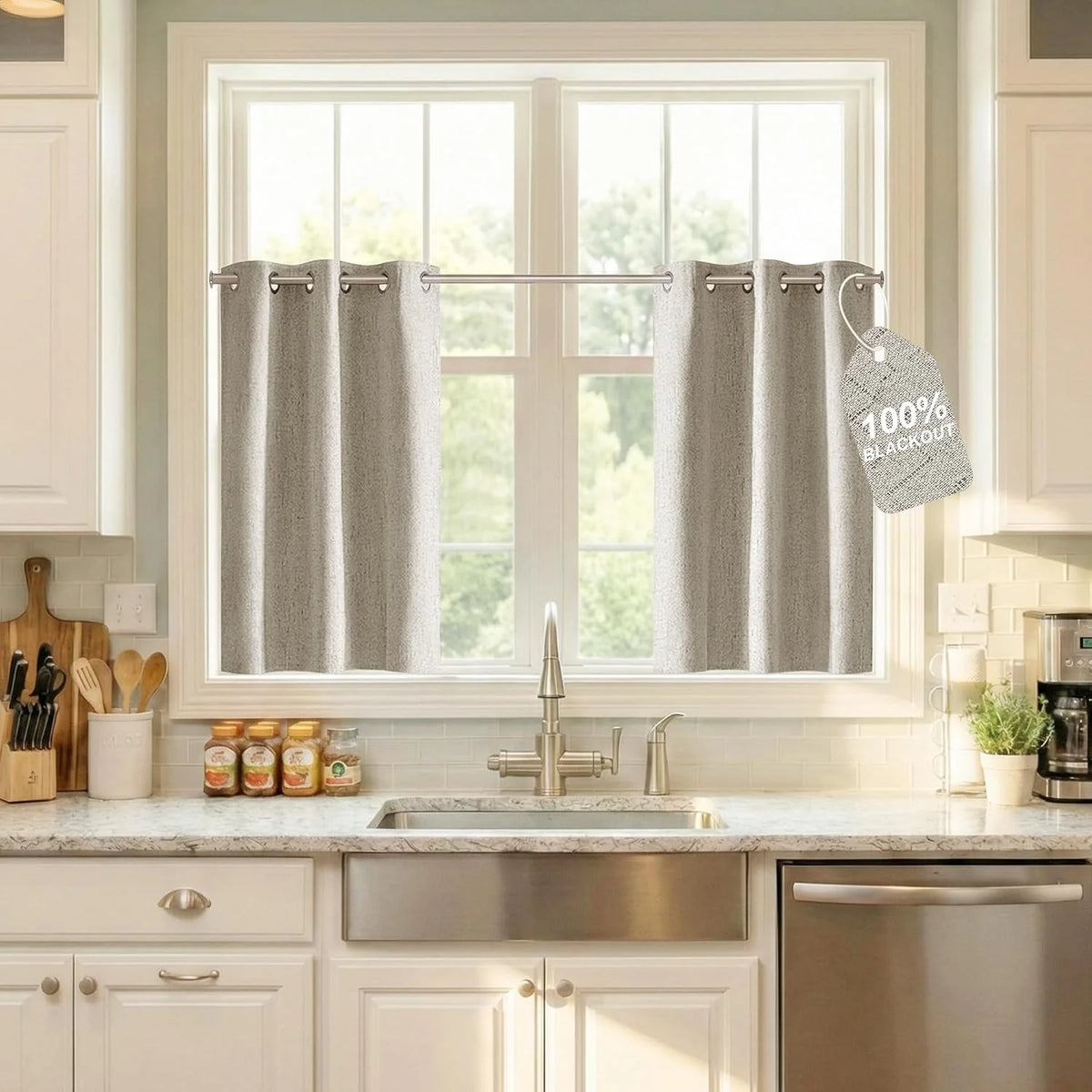 Gray textured blackout tier curtains with grommet top over a bright kitchen sink window