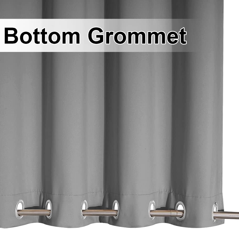 Close up of a gray thermal blackout curtain panel with metallic grommets along the bottom edge.