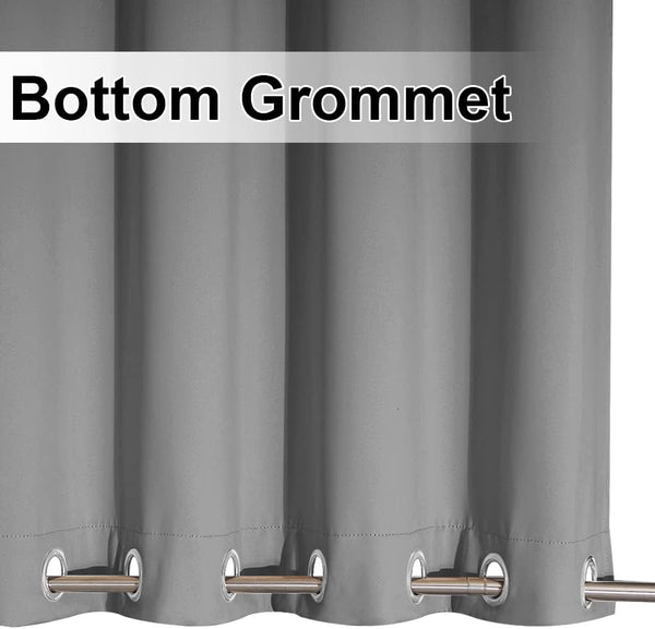 Close up of a gray thermal blackout curtain panel with metallic grommets along the bottom edge.