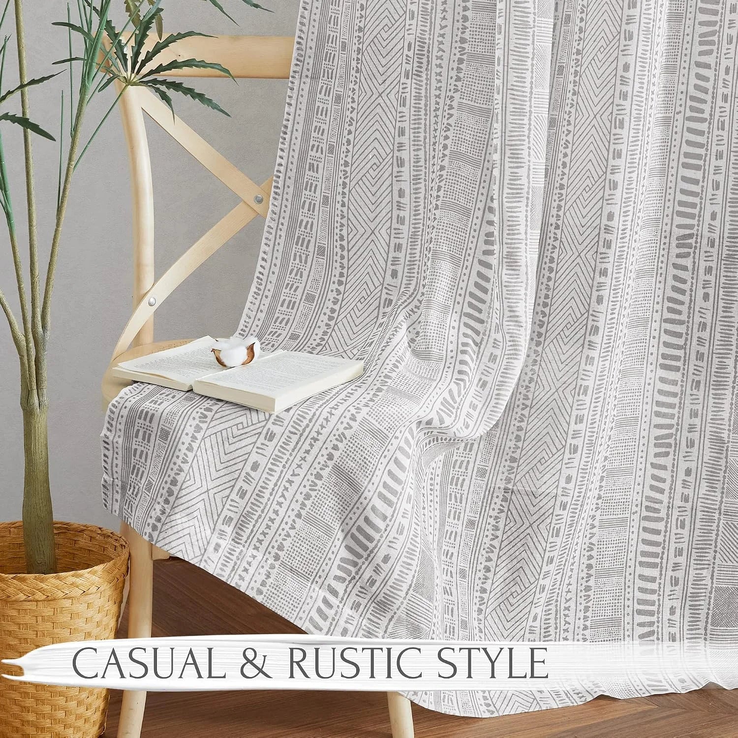 Gray tribal patterned fabric draped over a wooden chair in a casual rustic room