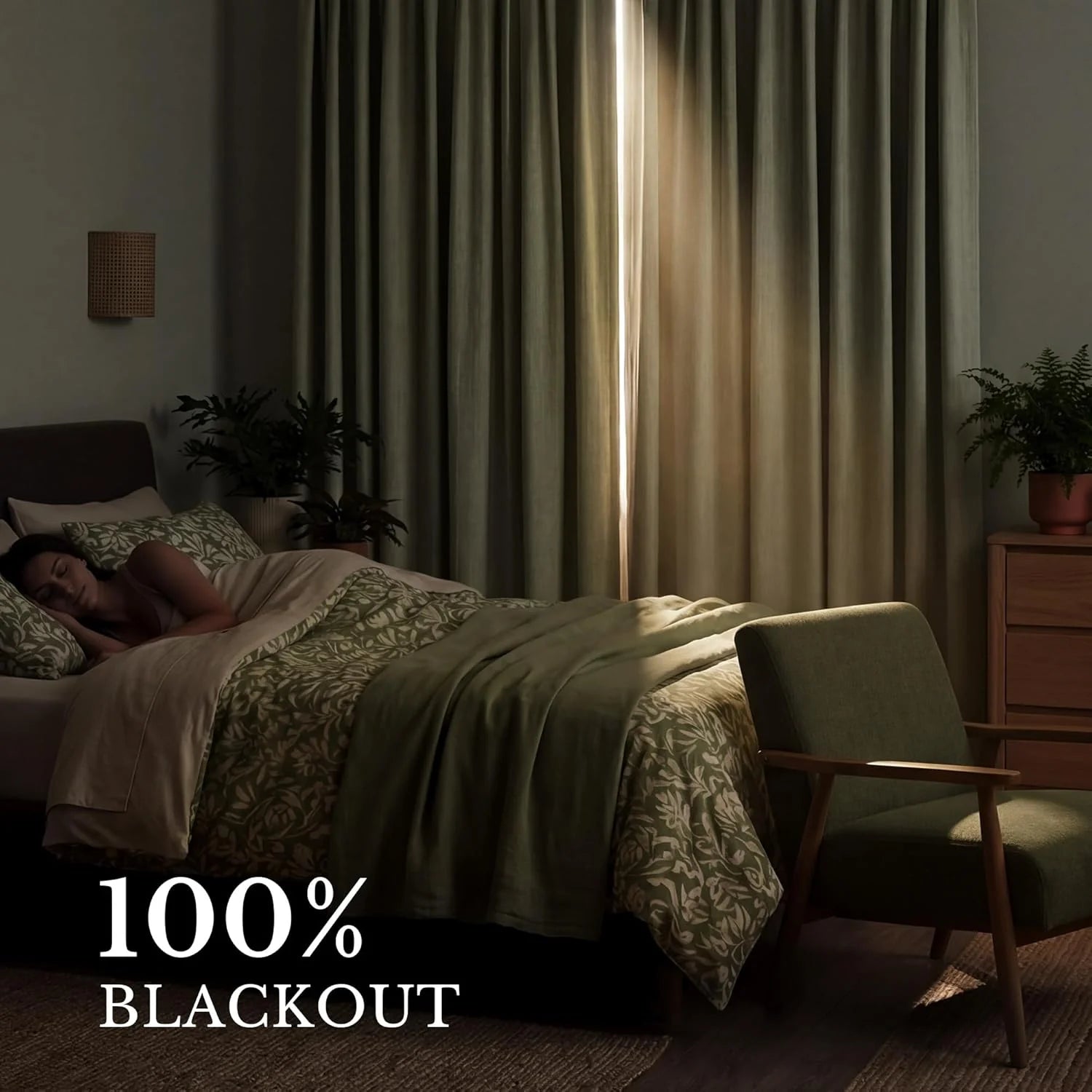 Peaceful bedroom scene with a sleeping person and effective olive green blackout curtains, demonstrating 100% light blocking.