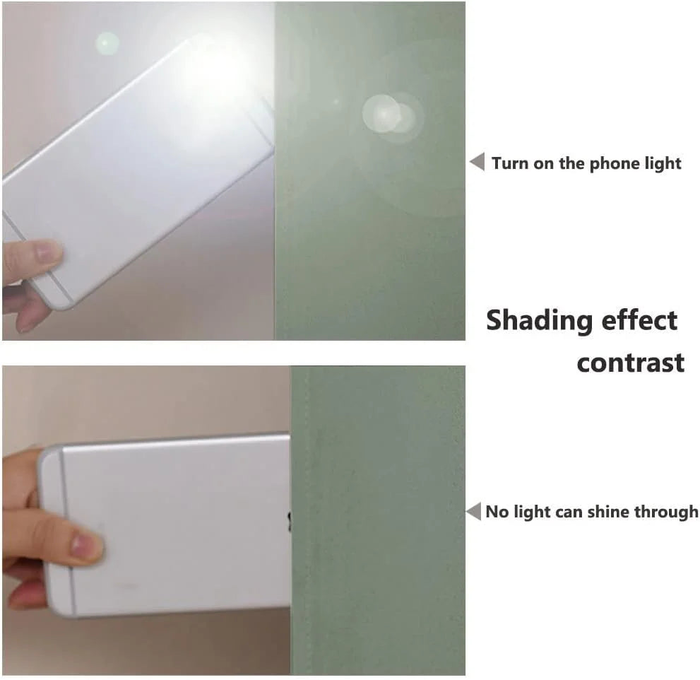 Phone flashlight behind sage green blackout fabric showing full light-blocking effect
