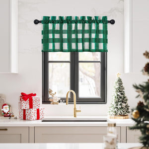Green and white buffalo check valance curtain with a shirred top hangs on a black rod over a kitchen sink.