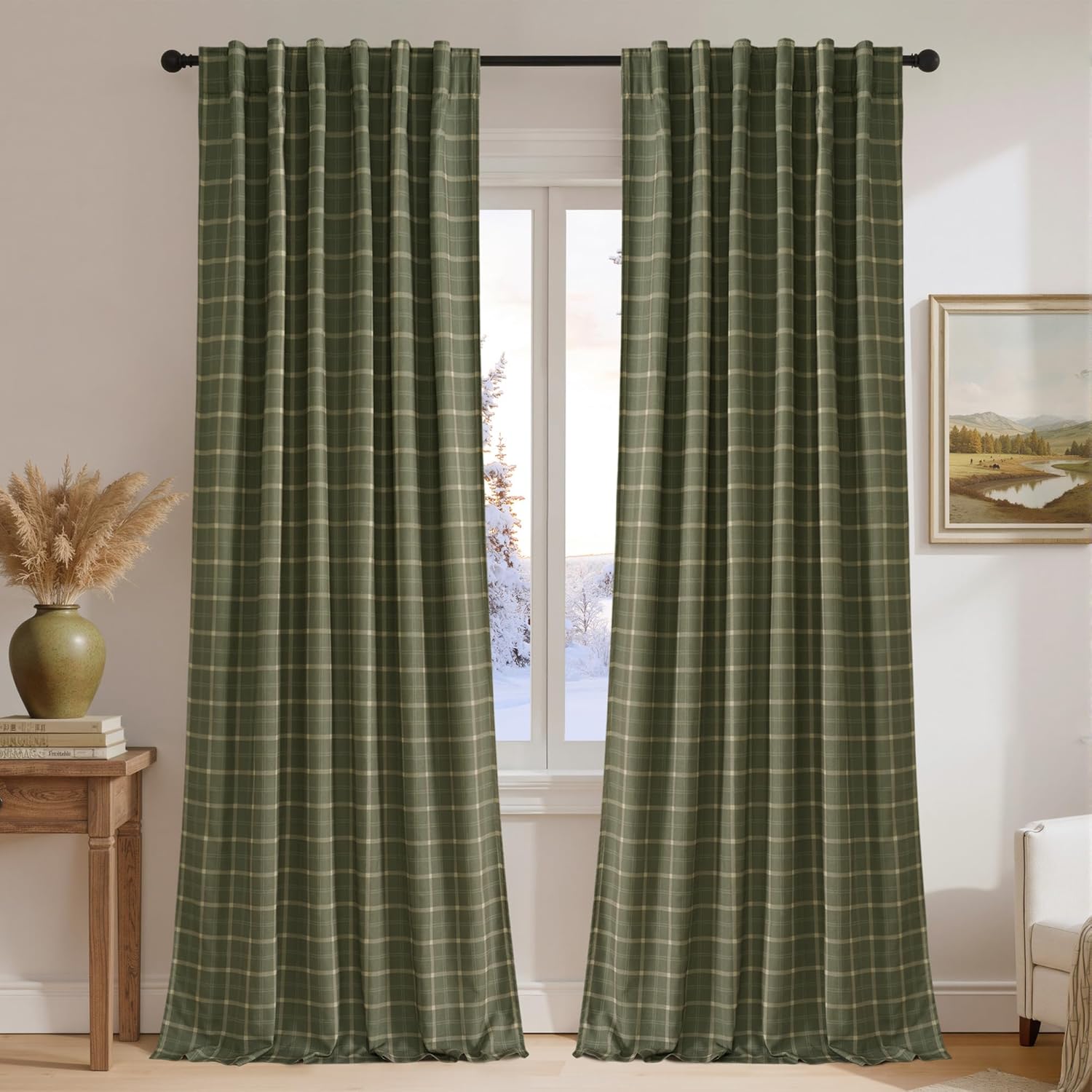Dark olive green plaid back tab curtains with light beige grid lines in a cozy room with snowy window.