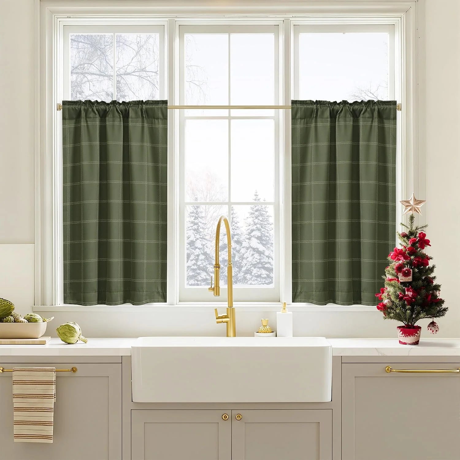 Green windowpane tier curtains on a white kitchen window above a farmhouse sink