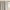 Close-up of a greige room darkening rod pocket curtain panel gathered on a decorative gold rod.