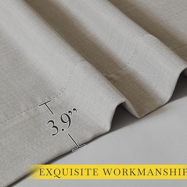 Close-up of greige textured woven curtain fabric showing a precisely sewn 3.9 inch wide hem.