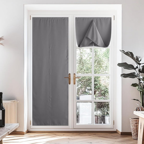 Grey adjustable privacy door curtains on a white French door, one panel fully down, the other rolled up for light.