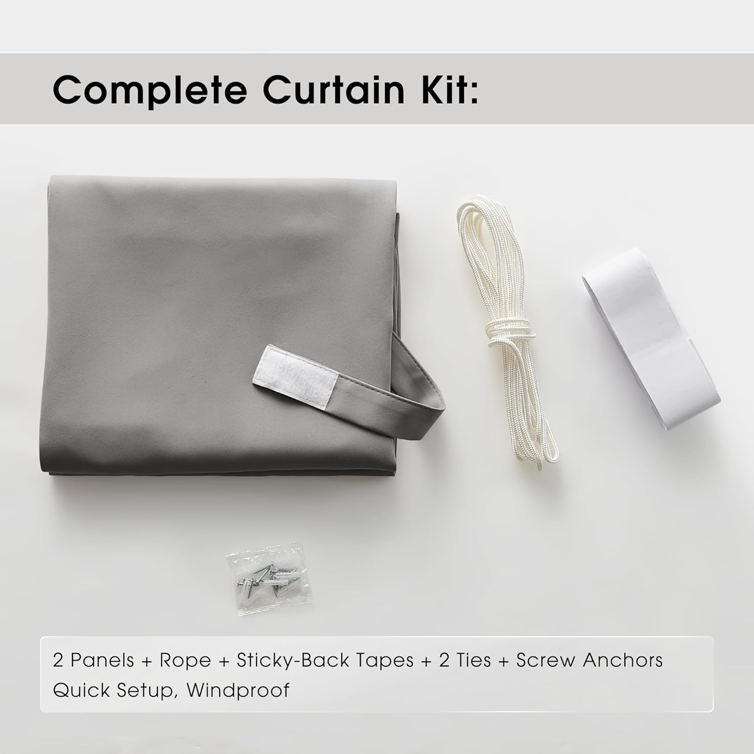 Grey blackout portable curtain kit showing two panels, white rope, sticky tapes, ties, and anchors.