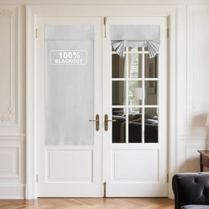 Light grey 100% blackout panel and tie-up roman shade on white French doors.