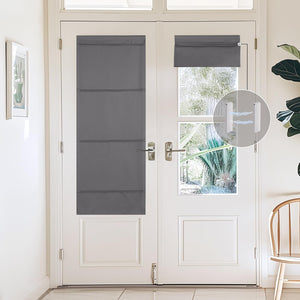 Grey magnetic Roman shades on white French doors. One extended, one rolled up, providing adjustable privacy.
