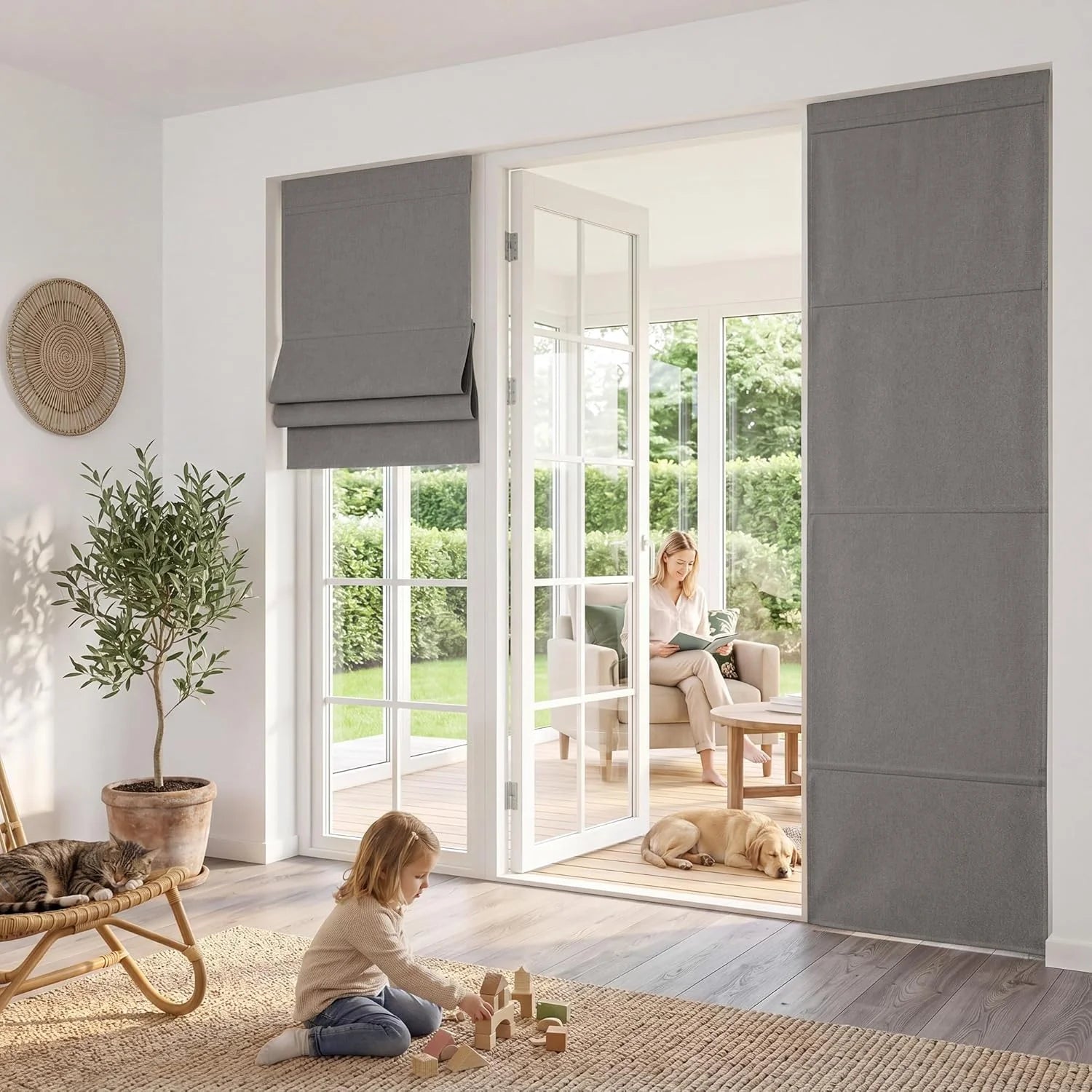 Grey Roman blind and matching panel blinds on patio doors in a modern family living room.
