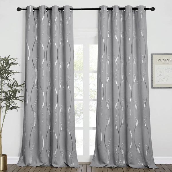 Pair of grey curtains with metallic silver wavy foil pattern and grommet tops, hanging on a black rod.